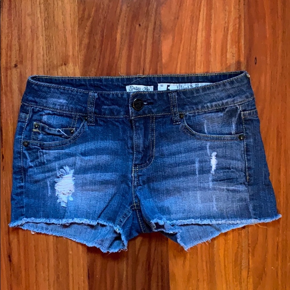 Distressed juniors denim shorts.